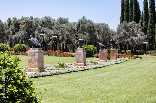 Unrivaled splendor of greenery and a decorative sculptures as decorations in Bahai Gardens near Acre city in northern Israel.