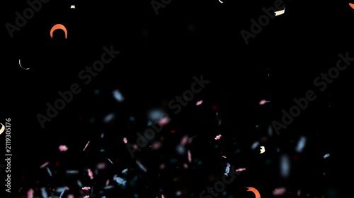 Colorful confetti streamers falling slowly down against a dark background for celebration with video multicolored streamers slow motion decoration animation festival