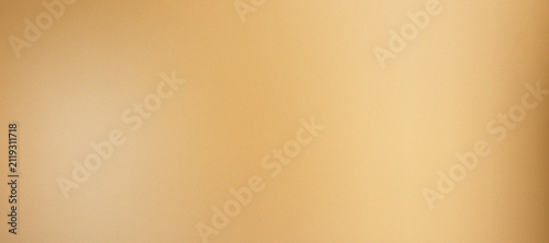 Abstract light brown and yellow grainy gradient background for designs