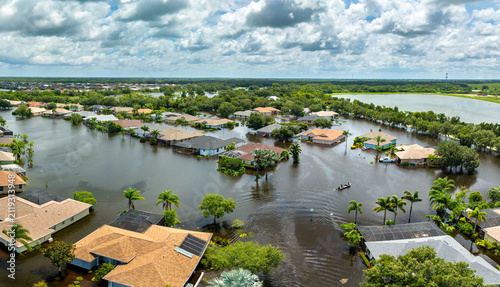 Flooded residential area with underwater houses from hurricane rainfall water in Florida suburban community. Aftermath of natural disaster in southern USA