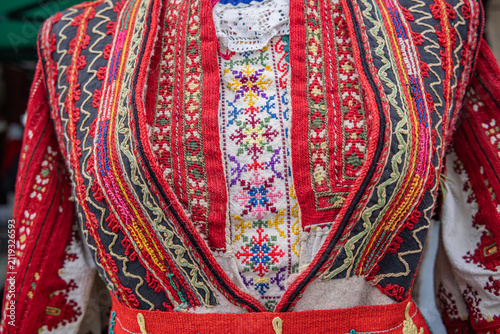 Traditional women's clothing for sale at a market in Bulgaria.
