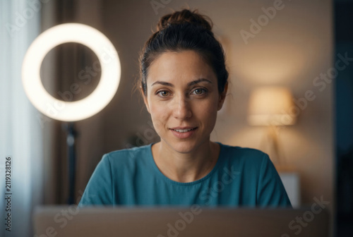 Woman Speaking Online With Ring Light in Home Office