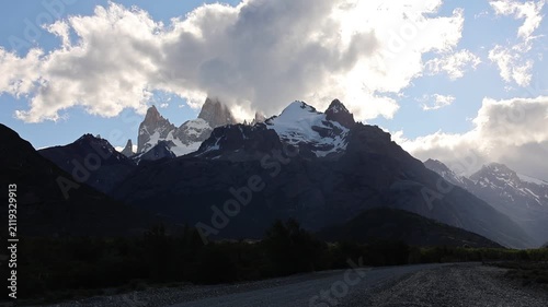 A clip showing an area within Los Glaciares National Park in Argentina, featuring beautiful snow-capped mountains and a cloudy sky.