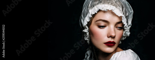 Portrait of a woman in a vintage sleeping cap.