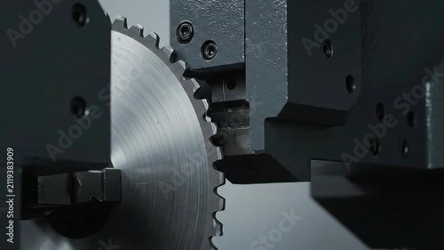 Close-Up View Of Industrial Machinery Featuring Precision Cutting Blade And Advanced Robotic Arm In A Modern Factory Setting
