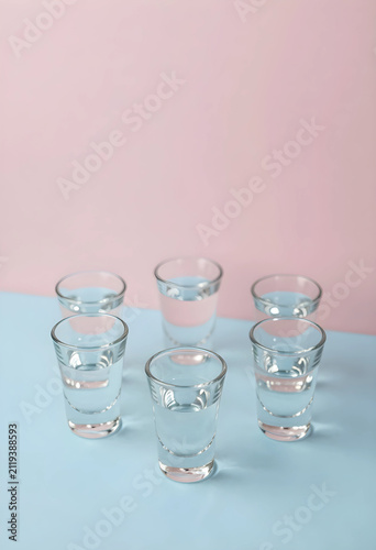 Six clear shot glasses fill...