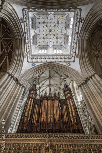 York, United Kingdom - 14 July 2026: View of the grand pipe organ and intricate vaulted ceiling inside the historic York Minster, featuring ornate stone carvings and gothic details.