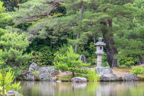 Traditional Japanese garden - pine, pond, stone lantern