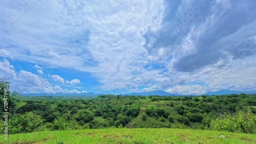 Timelapse of dramatic clouds over lush green landscape in Nagekeo, Flores, East Nusa Tenggara, Indonesia