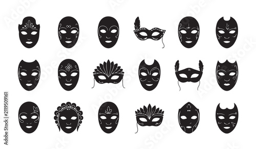 Collection of eighteen black and white traditional Venetian carnival masks with intricate details.