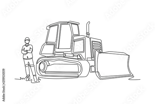Single one line drawing young male construction worker wearing safety helmet standing with arms crossed next to heavy crawler bulldozer vehicle. Continuous line draw design graphic vector illustration