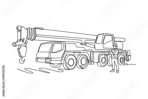 Single continuous line drawing male operator standing with arms folded beside a massive mobile crane truck on an industrial construction site. Dynamic one line draw graphic design vector illustration