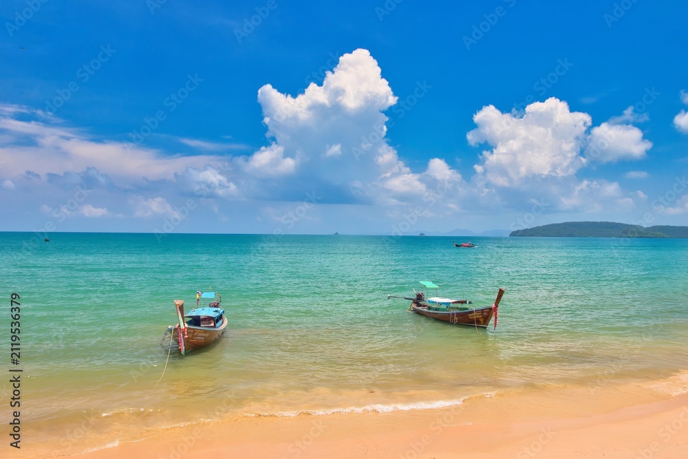 Obraz premiumThailand - Krabi - Ao Nang Beach July 22nd 2026. This was on a beautiful morning during the wet season. The Andaman sea during the low season surrounded by beautiful mountains.