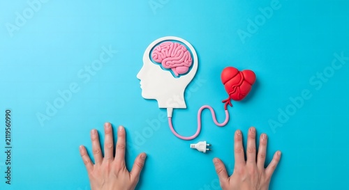 Conceptual image of human brain and heart connection with cables