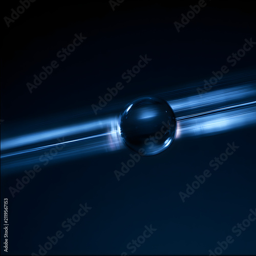 Transparent glass sphere floating on glass surface