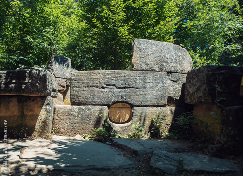 Fotografía Prehistoric megalithic tomb made of massive stone blocks hidden deep within a vi
