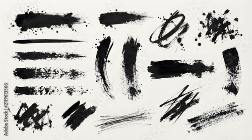 Set of black ink splatters and stains with brush strokes and drops on paper