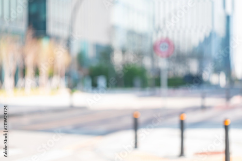 Abstract blurred background of modern city street with road bollards
