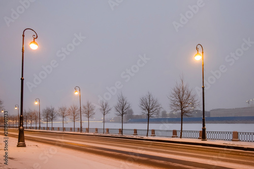winter road illuminated by lanterns