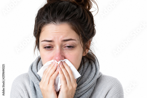 young woman sneezing