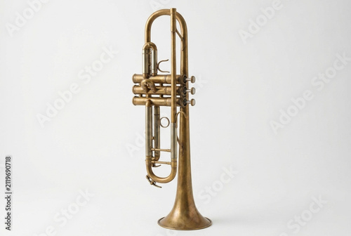 Old brass trumpet musical instrument standing upright