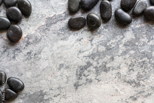 Photography Smooth stones on textured surface
