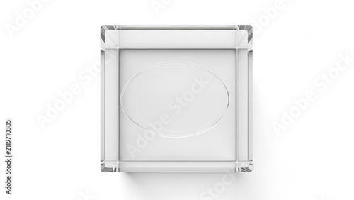 Clear glass cube with oval indentation on white background