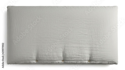Light gray linen bed pillow with buttons on white surface