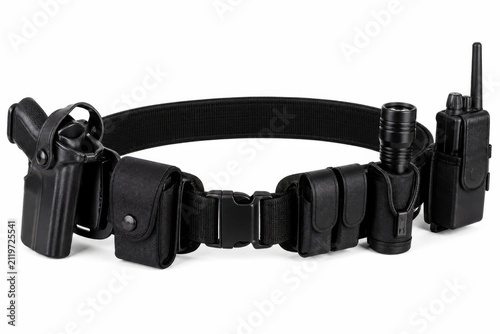 Tactical gun holster belt with multiple firearm attachments. Heavy-duty modular pistol carrier system for law enforcement and security professionals.