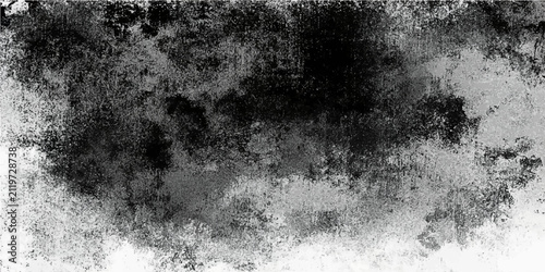 Obraz na płótnie Abstract monochrome textured grunge background with grainy overlay and mottled dark and light tones