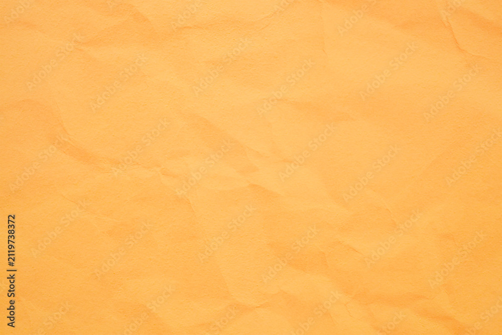 Fototapeta premium Warm orange paper texture background with copy space