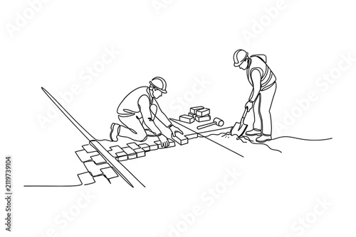 Continuous line drawing of two construction workers laying paving bricks on a site.