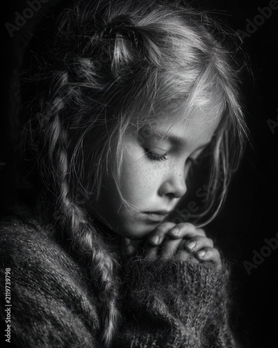 Child praying in peaceful spiritual moment with soft light atmosphere. Ai Generative