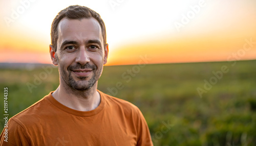 Man wearing rust orange shirt posing creating warm and relaxed casual dining portrait photography generative AI