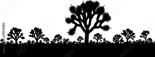 Black silhouette of several joshua trees standing on a flat desert horizon line
