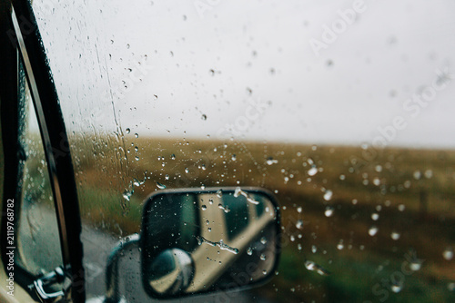 Rainy day road trip view from a car window