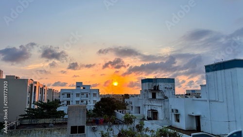 Fotografie Golden Sunrise Over Residential Neighborhood in Chennai, Tamil Nadu, India