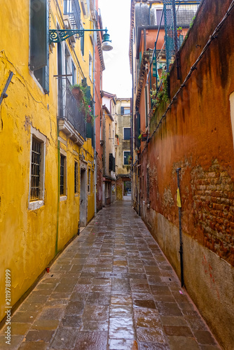 City of Venice, canal, bridge, gondola boats, alley and colorful local buildings and houses 