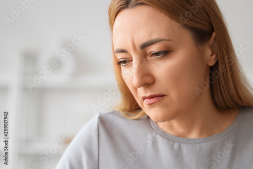Angry mature woman at home,...