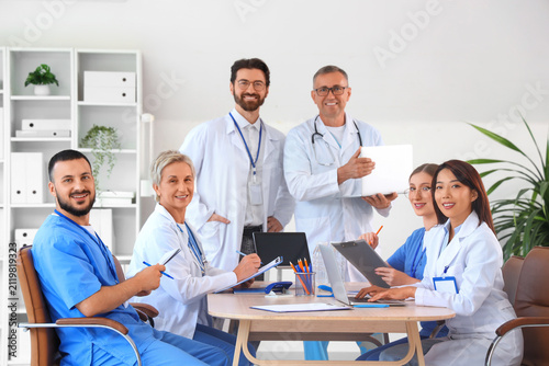 Team of doctors at table in...