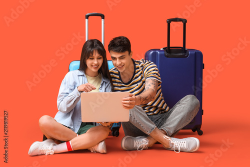 Couple of tourists with sui...