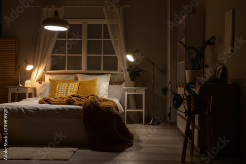 Interior of dark bedroom wi...