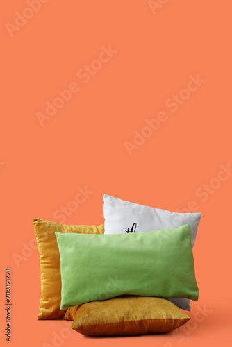 Decorative pillows on orang...