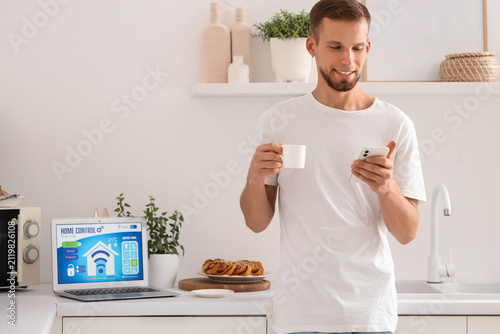 Young man with coffee cup u...