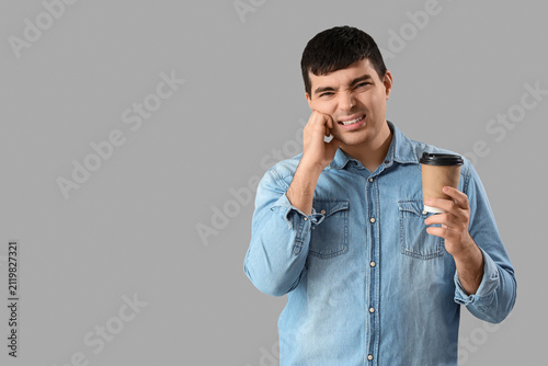 Young man with coffee cup s...