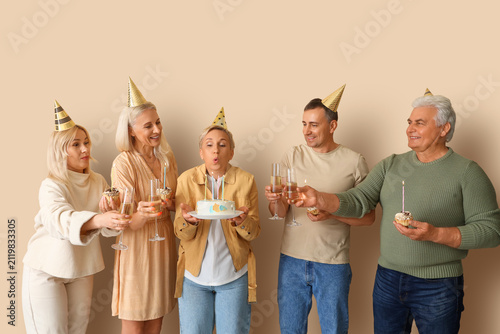 Mature people with cake and...