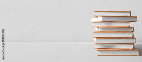 Stack of brown hardcover bo...