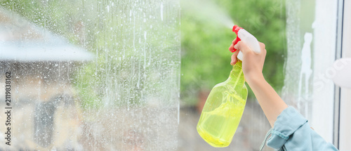 Person spraying cleaning so...