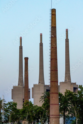Картината върху платно Barcelona, Spain – July 29, 2026: Industrial chimneys at former Barcelona power