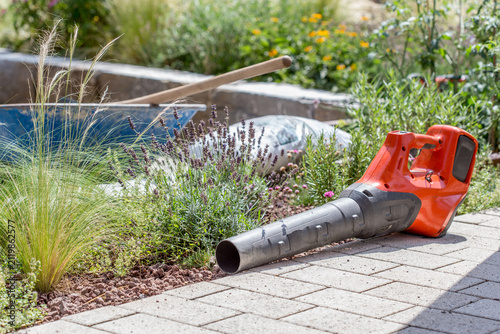 Leaf blower on natural stones in the garden, landscape gardening